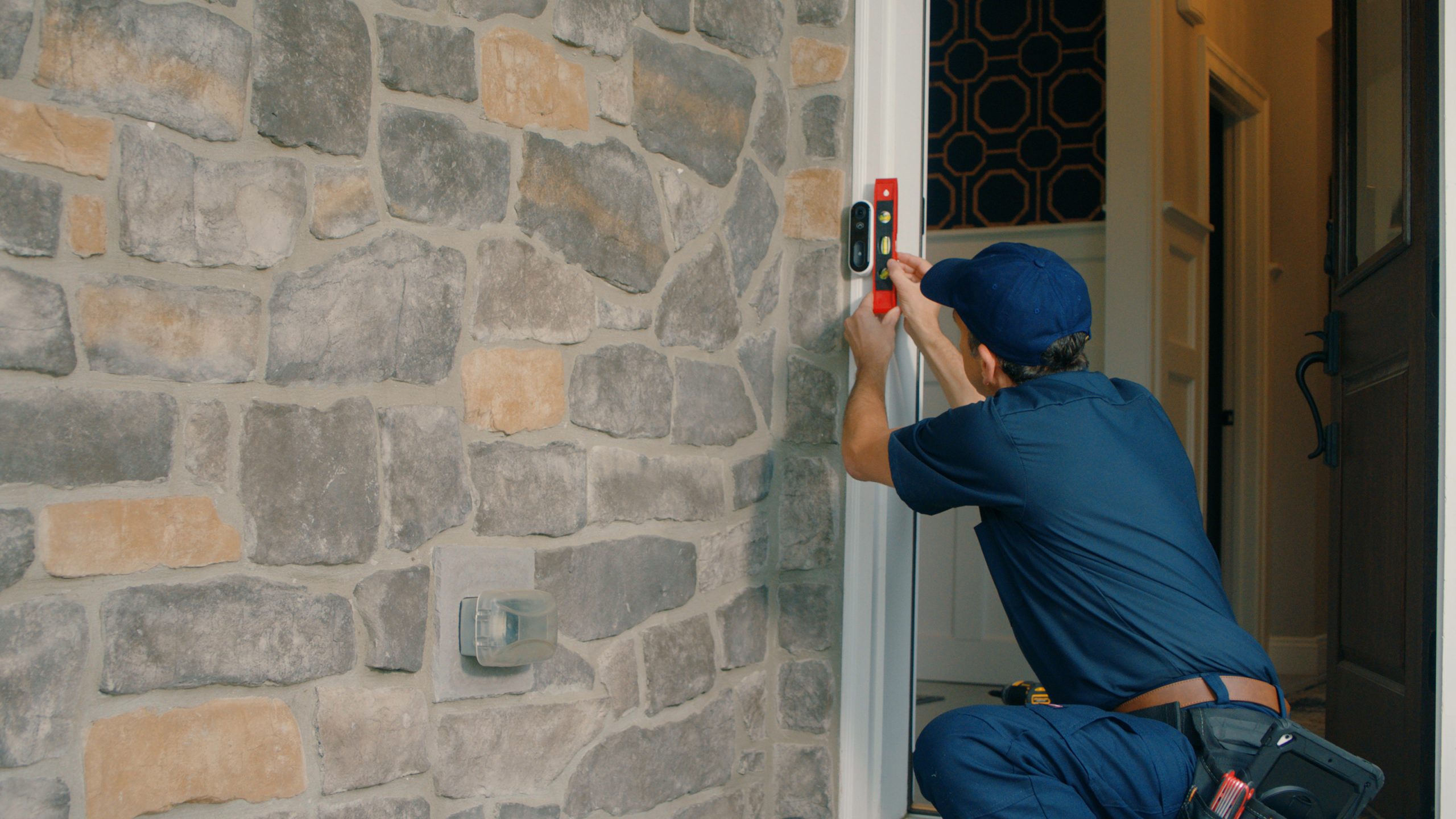 technician installing a video doorbell on the front door of a house, Security systems , cameras, home security